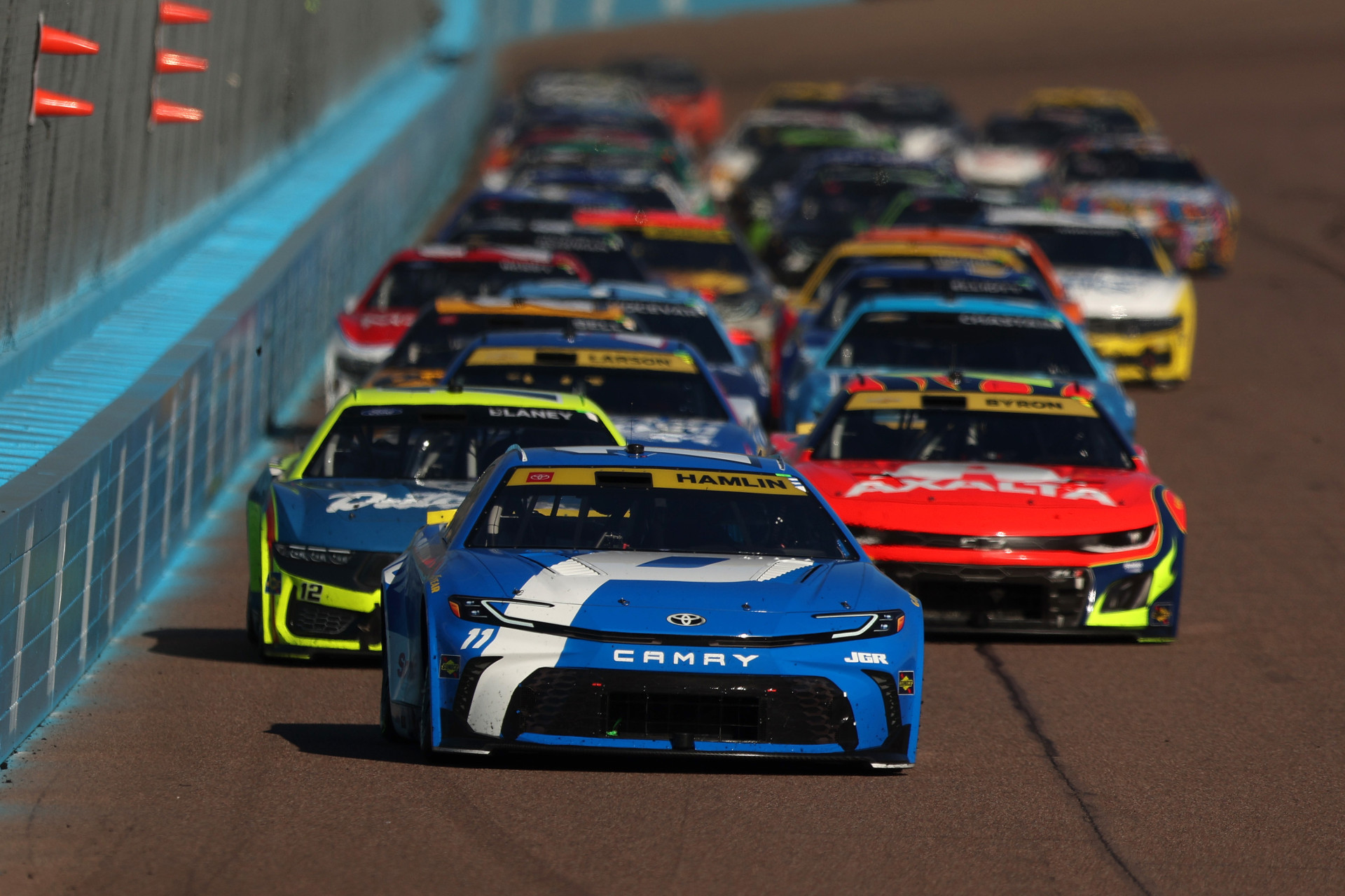 Denny Hamlin leads the NASCAR Cup Series Championship Race at Phoenix Raceway.